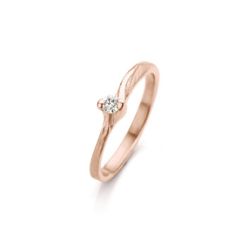 Rose gold simple engagement ring with uneven polished edges and details, a matte surface, and one diamond.