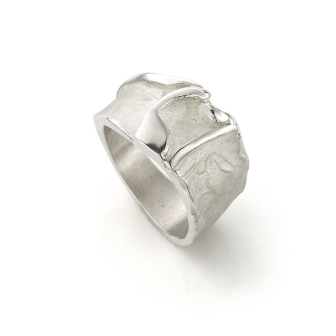 Silver ring with organic structure and a mix of matte and polished surfaces.
