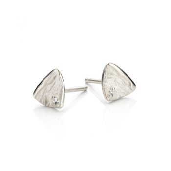 Subtle natural silver set in the shape of a triangle with a rough, matte finish and polished details.