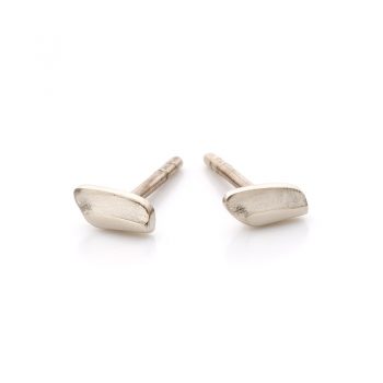 Minimalist gold earrings with elongated, matte surface and polished edges.